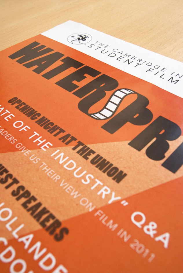 Not-so-close-up photograph of the poster for Watersprite 2011, black and white text on an orange background.