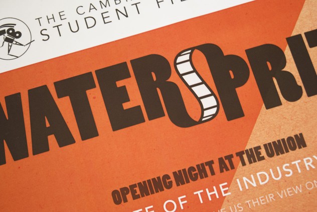 Close-up photograph of the poster for Watersprite 2011, black and white text on an orange background.