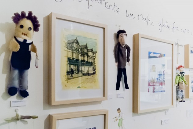 Photograph of my hanging in The Black Cat for Moments Around Mill Road. Also some other's bits.