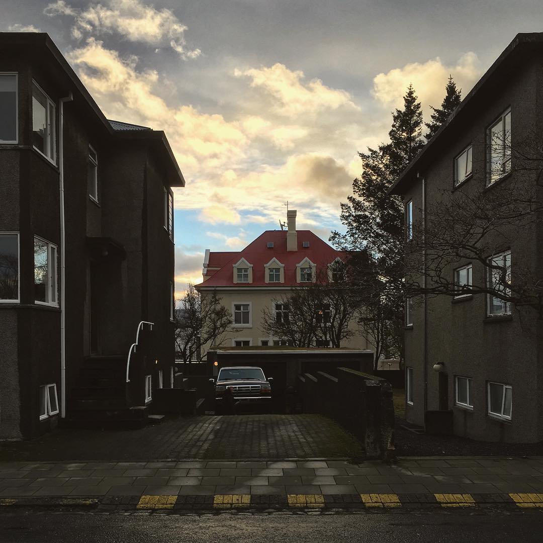 I unintentionally shot both sides of this house. #reykjavik #reykjavík #city #buildings #houses #building #house #street #sunset #clouds